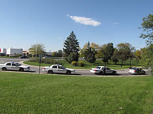 Three cruisers at a traffic stop.