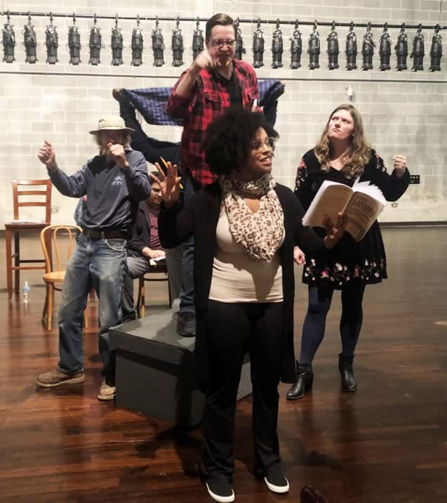 Michael Fisher, Kevin Kohn, Genesis Michael, and Melanie Morris rehearse a scene from The Laramie Project. at GSU