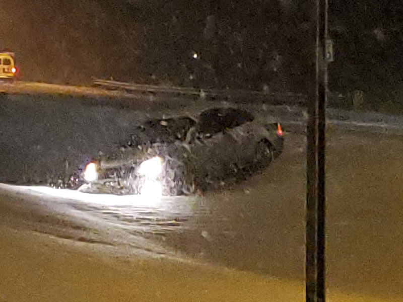Car in an icy ditch on 26th Street