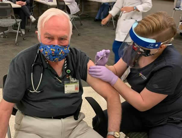 Dr. Mark McKeigue gets his first COVID-19 vaccine