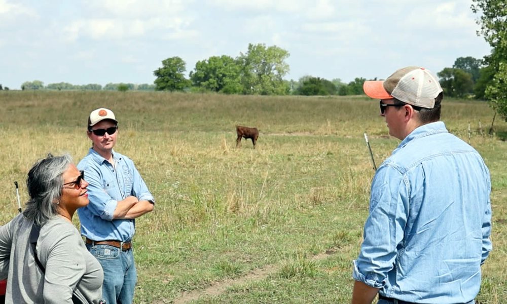 Congresswoman Kelly surveys cattle at the Cow Creek Farm in Paxton, IL