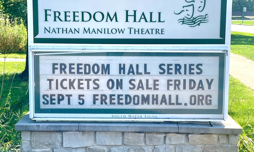 2025-2025 Freedom Hall Season, outdoor sign with trees in the background