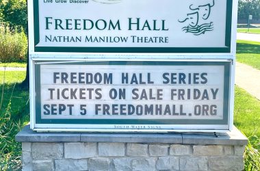 2025-2025 Freedom Hall Season, outdoor sign with trees in the background
