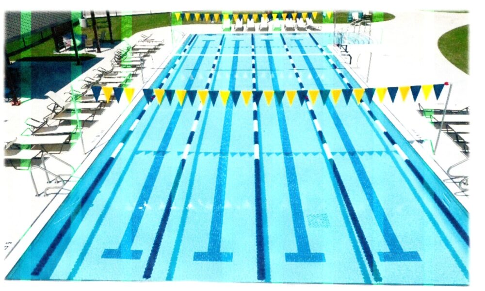 four-lane lap pool with lounge chairs to either side