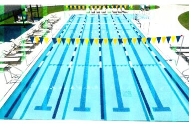 four-lane lap pool with lounge chairs to either side