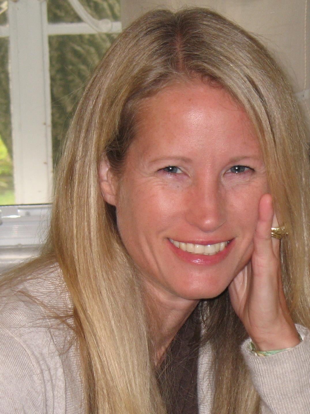 photo of woman with her hand against side of her face