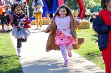 Two girls running on Pumpkin Day 2025