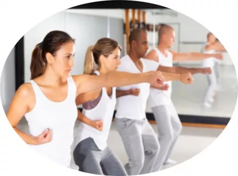 men and women learning self-defenses poses