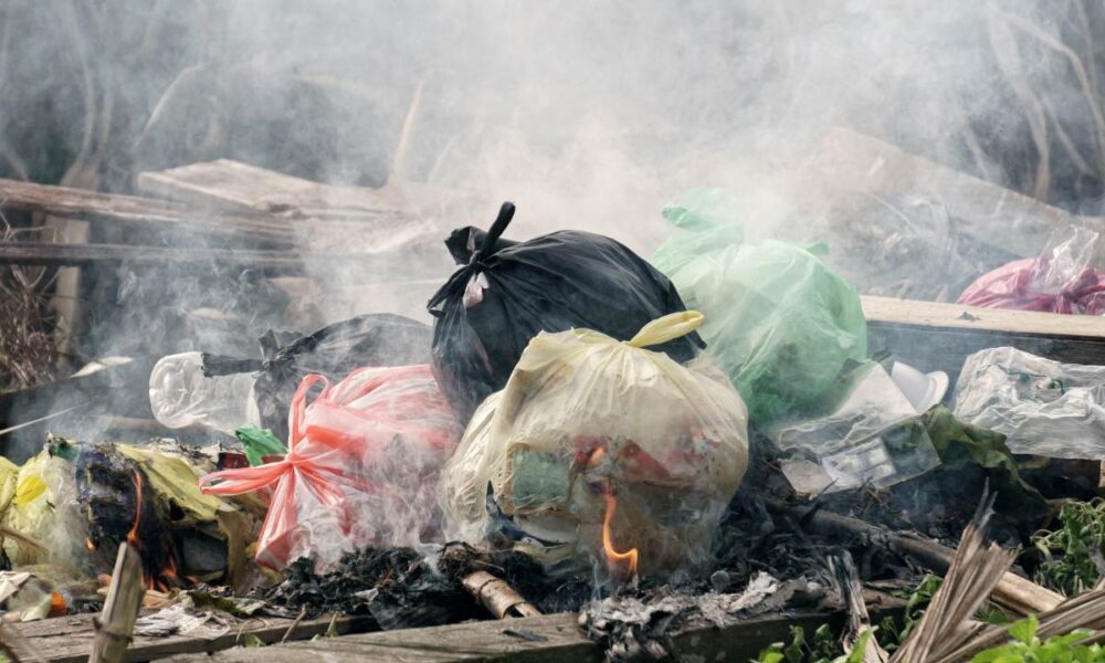 burning garbage, call 911